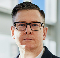 CEO and executive Alexander Hughes at a crypto trading company, portrait